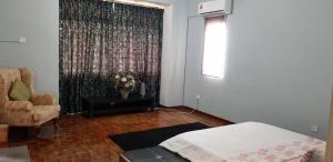 Postel nebo postele na pokoji v ubytování Tun Perak Homestay