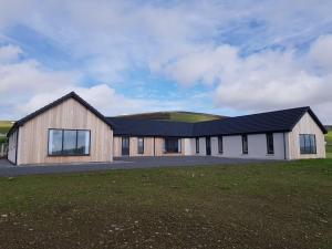 a rendering of a house with a black roof at Cottiscarth Cottages in Finstown