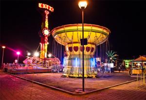 a carnival ride in a park at night at Airen Hotel Velipoje in Velipojë
