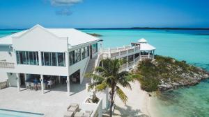 an aerial view of a house on a beach at Neptune Villas in Five Cays Settlement