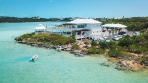 an aerial view of a house on an island in the water at Neptune Villas in Five Cays Settlement