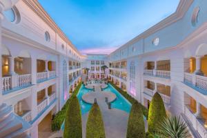 an aerial view of the courtyard of a building with a swimming pool at Elinotel Apolamare Hotel in Hanioti