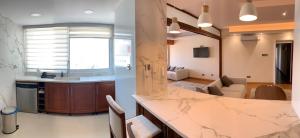 a kitchen and living room with a marble counter top at Modern 2 bed room large apartment in Nicosia