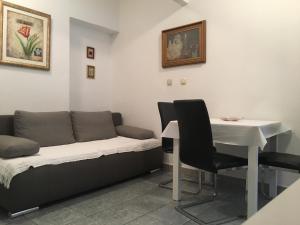 a living room with a couch and a table at Apartmani Mare in Split