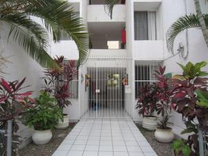 a door to a building with plants in front of it at Hotel Vagabundo Puerto Vallarta in Puerto Vallarta