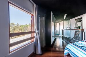 a bedroom with a window and a bed in a room at Loft La Fuente in Telde