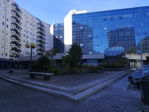 a parking lot in front of some buildings at Architect House in Porto