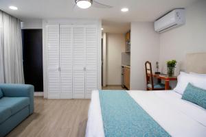 Voodi või voodid majutusasutuse Suites Coben Apartamentos Amueblados toas