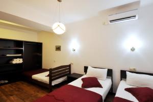 Ein Bett oder Betten in einem Zimmer der Unterkunft Tbilisi Check In