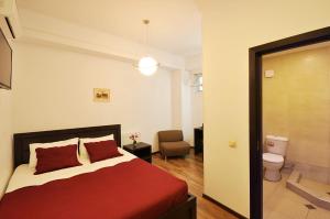 Ein Bett oder Betten in einem Zimmer der Unterkunft Tbilisi Check In