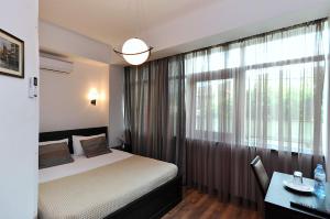 Ein Bett oder Betten in einem Zimmer der Unterkunft Tbilisi Check In