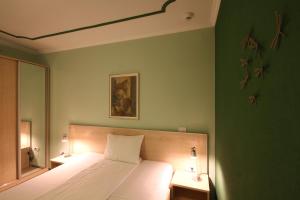 Postel nebo postele na pokoji v ubytování Hotel Aruba