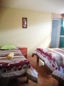Postel nebo postele na pokoji v ubytování Sami House