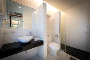 a bathroom with a sink and a toilet at Hotel Sentral Pudu @ City Centre / Bukit Bintang in Kuala Lumpur