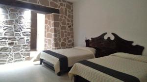 Postel nebo postele na pokoji v ubytování Casa de Cactus + 26 fotografií