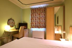 Postel nebo postele na pokoji v ubytování Hotel Aruba