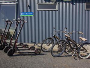 
a row of bicycles parked next to a building at Alpine-Pacific Holiday Park in Kaikoura
