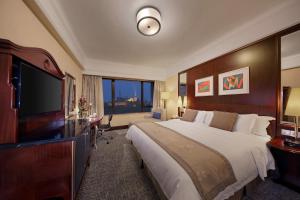 Voodi või voodid majutusasutuse Hotel Royal Macau toas