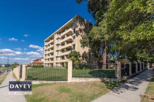 a building with a fence in front of it at Apartment with a View in Perth