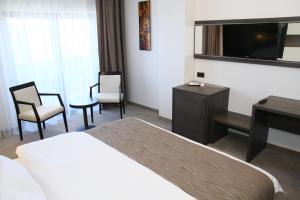 TV a/nebo společenská místnost v ubytování Hotel Scapino