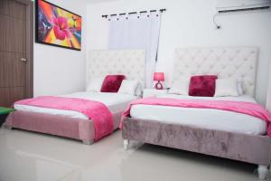 Ein Bett oder Betten in einem Zimmer der Unterkunft Hotel Platinum Barranquilla