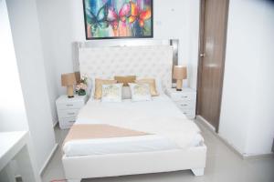 Ein Bett oder Betten in einem Zimmer der Unterkunft Hotel Platinum Barranquilla