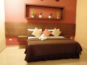 En eller flere senge i et værelse på Villa San Antonio de Padua