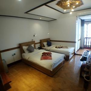 Ένα ή περισσότερα κρεβάτια σε δωμάτιο στο Kong Loon 1