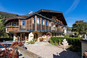 a large house with a balcony on top of it at Residence Intica in San Candido