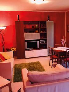 a living room with a couch and a table at CASA MAJA casa per vacanze abruzzo in Lettomanoppello