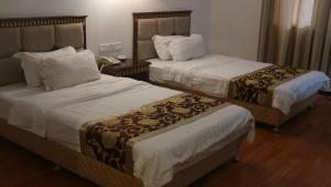 Uma cama ou camas num quarto em Excelsior Resort