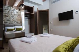 Posteľ alebo postele v izbe v ubytovaní Kamartos Villa 1