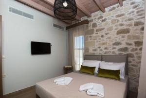 Posteľ alebo postele v izbe v ubytovaní Kamartos Villa 1
