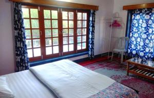 Postel nebo postele na pokoji v ubytování Saiman Guest House