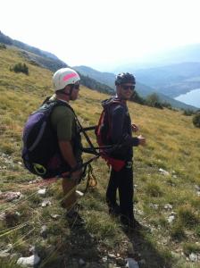 two men standing on top of a hill with backpacks at Casa Germanoff in Ohrid