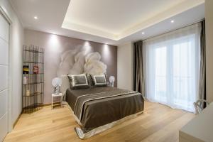 Postel nebo postele na pokoji v ubytování Quarto Novo Suite