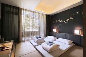 Letto o letti in una camera di 礁溪晶泉丰旅 Wellspring by Silks Jiaoxi