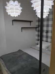En eller flere senge i et værelse på Apartament Plac Kościuszki