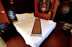Postel nebo postele na pokoji v ubytování Baanfai Guesthouse Chiangkhong