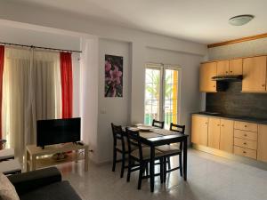 a kitchen and dining room with a table and chairs at 7tierras in El Paso