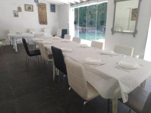 a dining room filled with tables and chairs at Villa Aruch in Florence