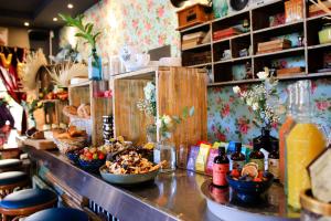 a counter with bowls of food and drinks on it at Hôtel Le G (ex Le Genève) in Nice