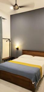 a bedroom with a large bed with a ceiling at Memory Lane in Colombo