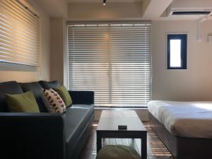 Postel nebo postele na pokoji v ubytování Condominium MIRAHAKONE