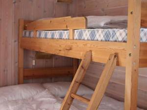 
En eller flere køyesenger på et rom på Three-Bedroom Holiday home in Trysil
