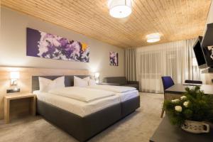 Postel nebo postele na pokoji v ubytování KOSIS Sports Lifestyle Hotel