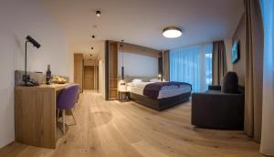 Postel nebo postele na pokoji v ubytování KOSIS Sports Lifestyle Hotel