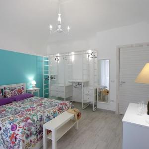 A bed or beds in a room at La Casetta di Meta