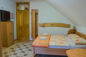 En eller flere senge i et værelse på Miškar Rooms