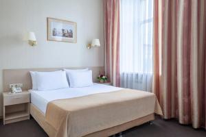  Кровать или кровати в номере Отель Бристоль 